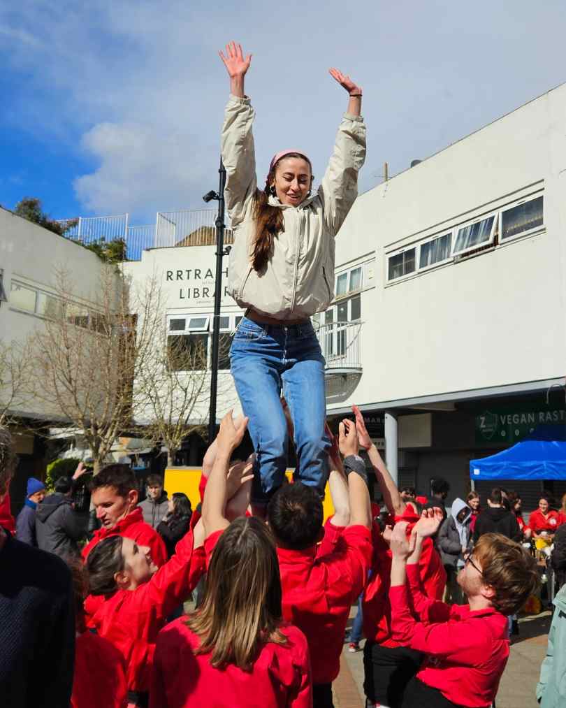 woman practising a castell in the blue market